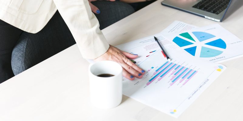 office-woman-hands-on-report-scaled.jpg